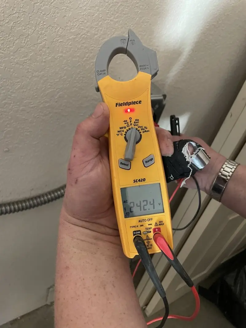Voltage testing with clamp meter during Generator Installation in Dardenne Prairie